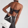Μικρή τσάντα ώμου Prada Traveller με επένδυση από Re-Nylon Μικρή τσάντα ώμου Prada Traveller με επένδυση από Re-Nylon